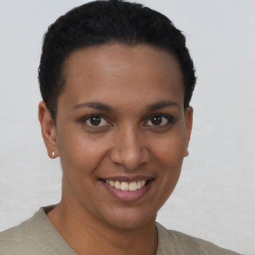 Joyful latino young-adult female with short  brown hair and brown eyes