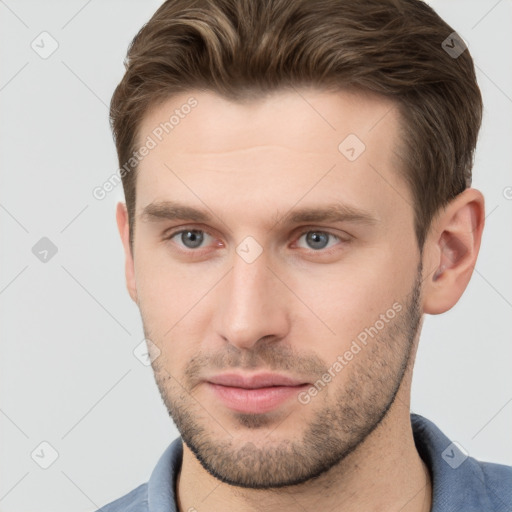 Neutral white young-adult male with short  brown hair and grey eyes