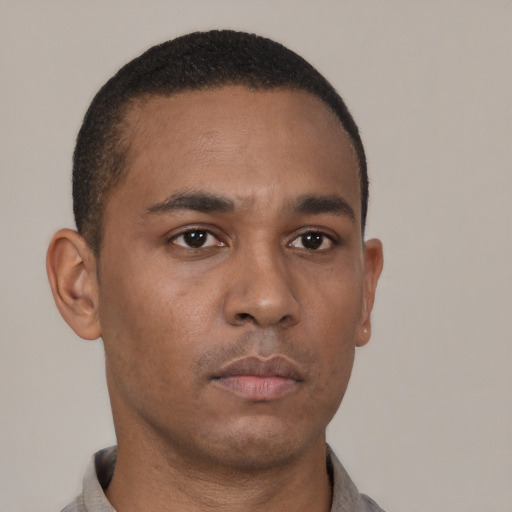 Neutral latino young-adult male with short  brown hair and brown eyes