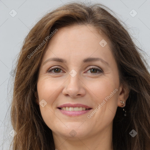 Joyful white adult female with long  brown hair and brown eyes