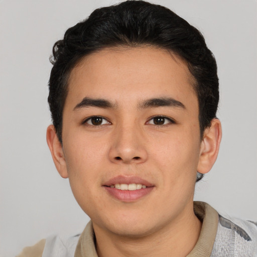 Joyful asian young-adult male with short  black hair and brown eyes