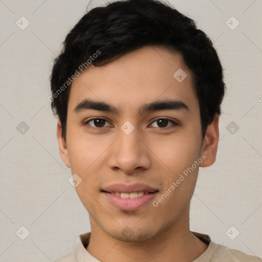 Joyful latino young-adult male with short  black hair and brown eyes