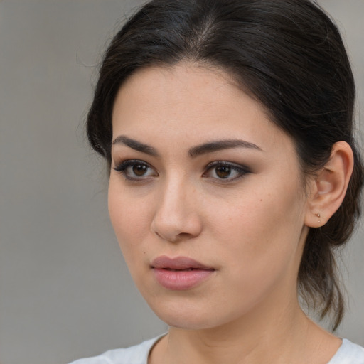 Neutral white young-adult female with medium  brown hair and brown eyes