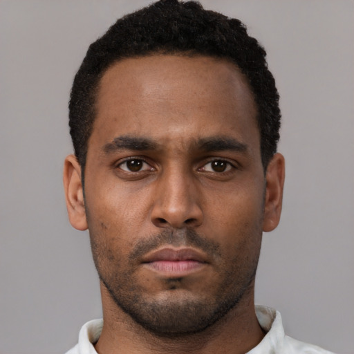Neutral black young-adult male with short  brown hair and brown eyes