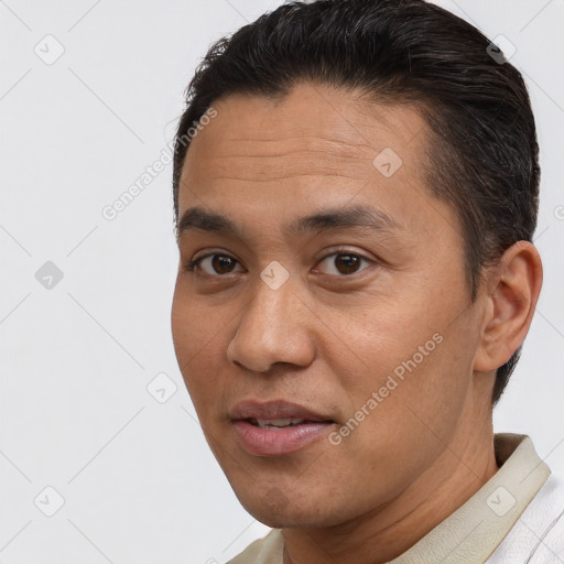 Joyful white adult male with short  brown hair and brown eyes