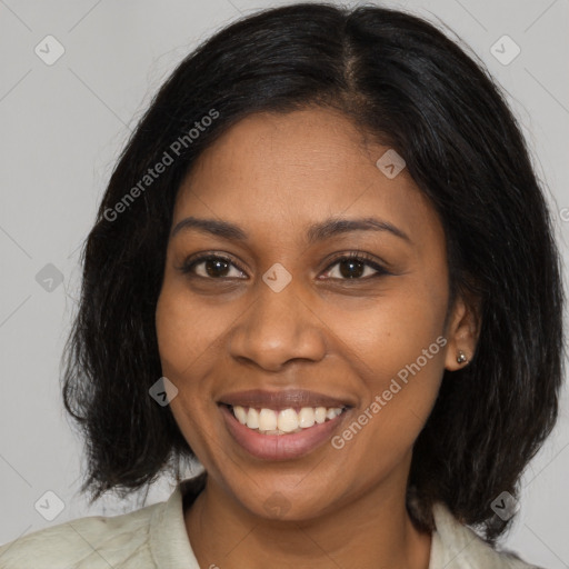 Joyful black young-adult female with medium  brown hair and brown eyes