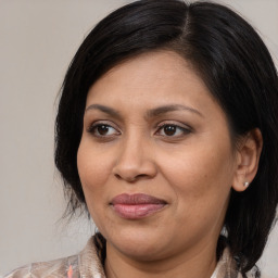 Joyful white adult female with medium  brown hair and brown eyes