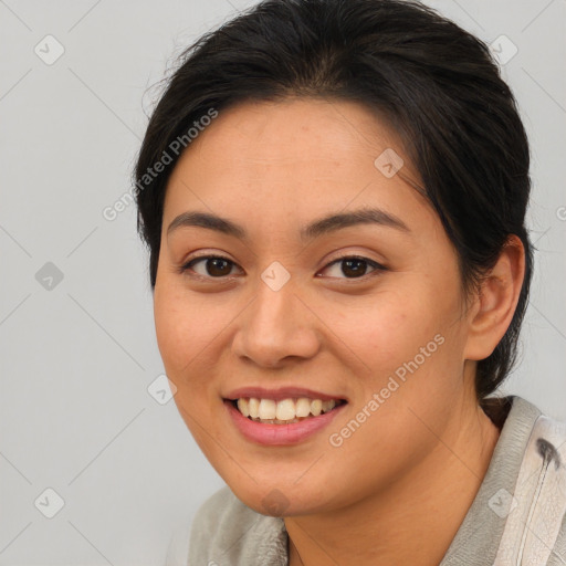 Joyful asian young-adult female with medium  brown hair and brown eyes