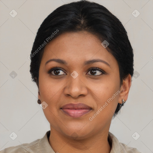 Joyful black adult female with short  brown hair and brown eyes