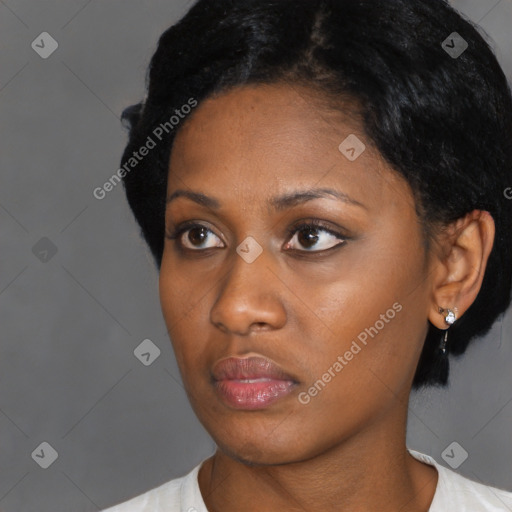 Neutral black young-adult female with short  black hair and brown eyes