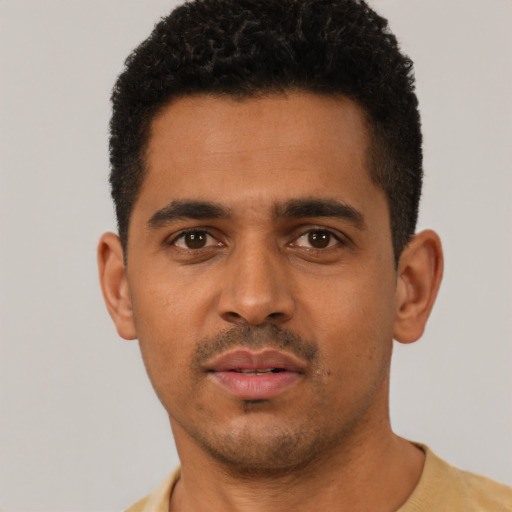 Neutral latino young-adult male with short  black hair and brown eyes