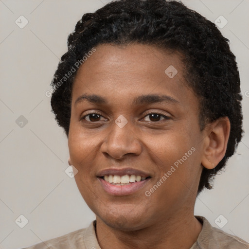 Joyful black young-adult female with short  black hair and brown eyes