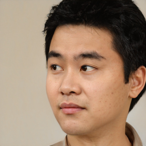 Neutral asian young-adult male with short  black hair and brown eyes