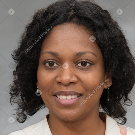 Joyful black young-adult female with medium  brown hair and brown eyes