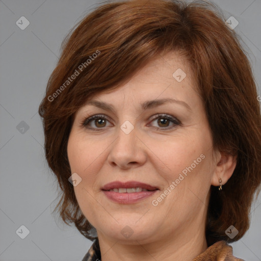 Joyful white adult female with medium  brown hair and brown eyes