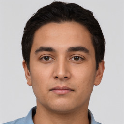 Neutral white young-adult male with short  black hair and brown eyes