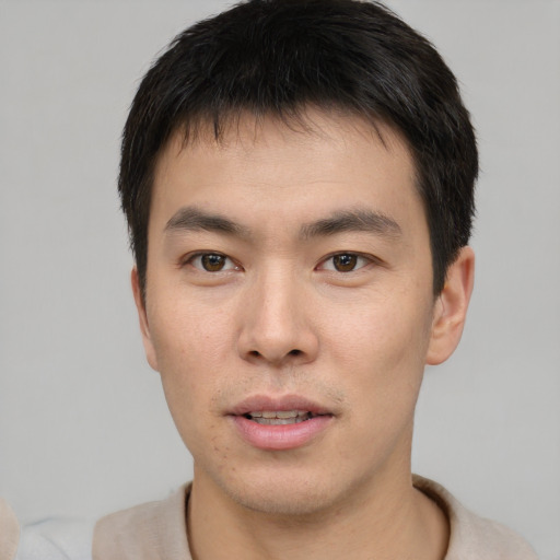 Neutral asian young-adult male with short  brown hair and brown eyes