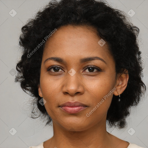 Joyful black young-adult female with medium  black hair and brown eyes