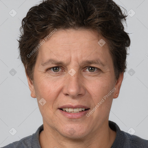 Joyful white adult female with short  brown hair and brown eyes