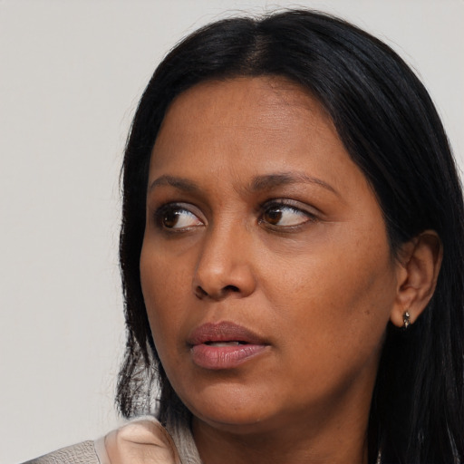 Neutral black adult female with medium  black hair and brown eyes