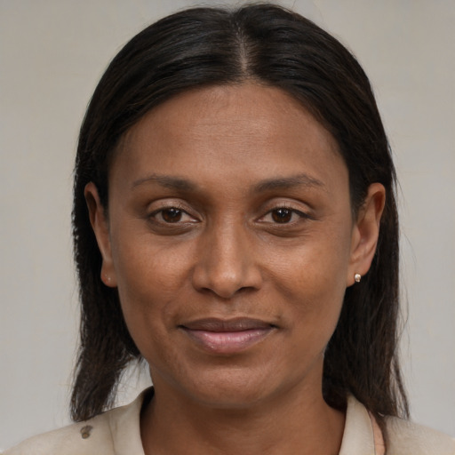 Joyful black young-adult female with medium  brown hair and brown eyes