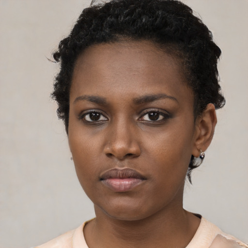 Neutral black young-adult female with short  black hair and brown eyes
