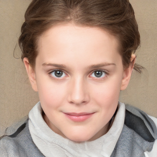 Joyful white child female with short  brown hair and blue eyes