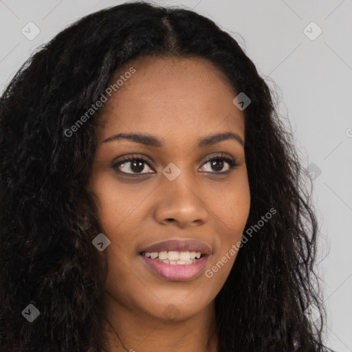 Joyful black young-adult female with long  brown hair and brown eyes