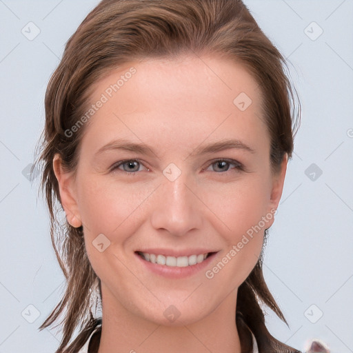 Joyful white young-adult female with medium  brown hair and grey eyes