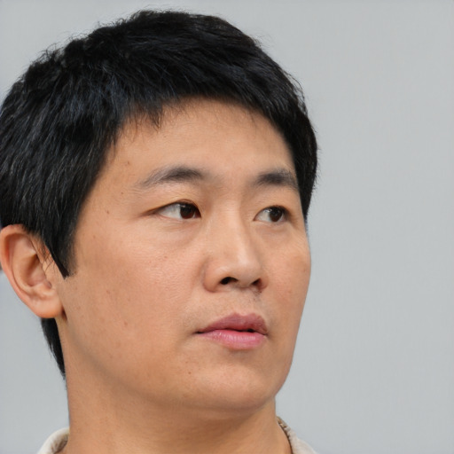 Neutral asian young-adult male with short  black hair and brown eyes