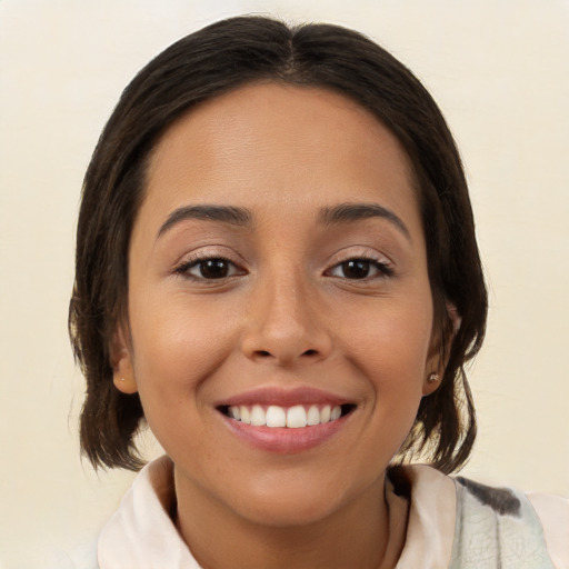 Joyful white young-adult female with medium  brown hair and brown eyes