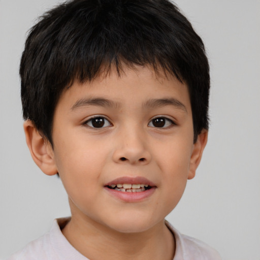 Joyful white child male with short  brown hair and brown eyes