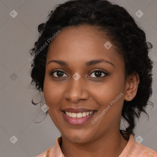 Joyful black young-adult female with medium  brown hair and brown eyes