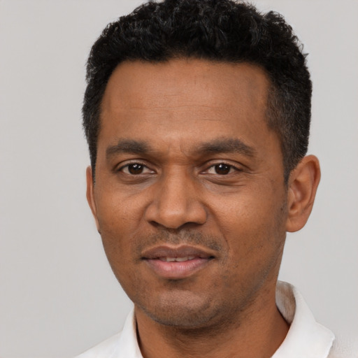 Neutral latino adult male with short  black hair and brown eyes