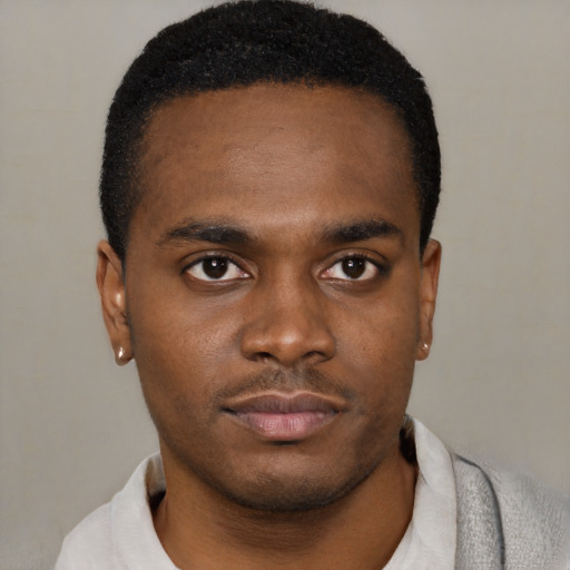 Neutral black young-adult male with short  black hair and brown eyes