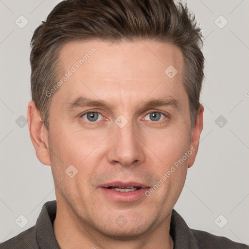 Joyful white adult male with short  brown hair and grey eyes