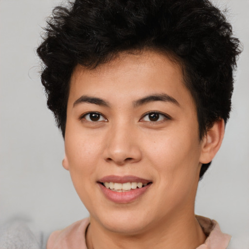 Joyful asian young-adult female with short  brown hair and brown eyes
