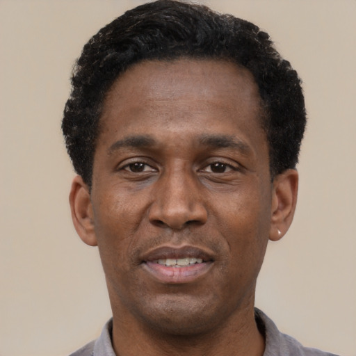 Neutral latino adult male with short  black hair and brown eyes