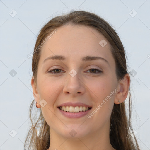 Joyful white young-adult female with long  brown hair and grey eyes