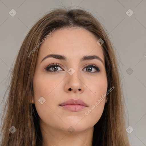 Neutral white young-adult female with long  brown hair and brown eyes