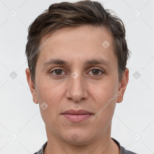 Joyful white adult male with short  brown hair and grey eyes