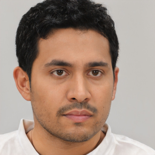 Neutral latino young-adult male with short  black hair and brown eyes