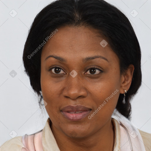 Joyful black adult female with medium  brown hair and brown eyes