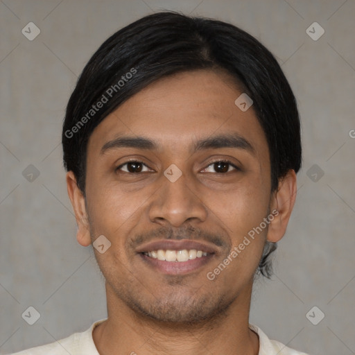 Joyful latino young-adult male with short  black hair and brown eyes