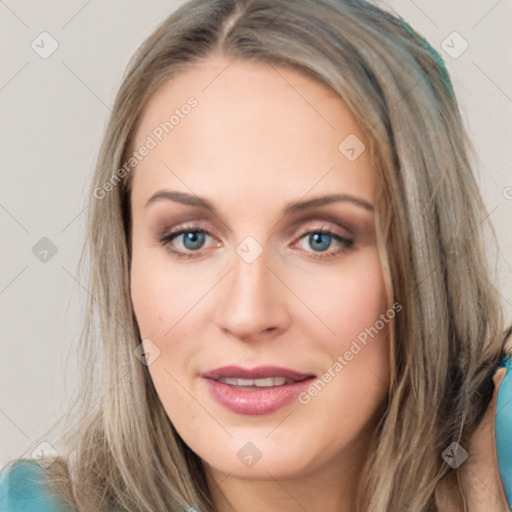 Joyful white young-adult female with long  brown hair and blue eyes