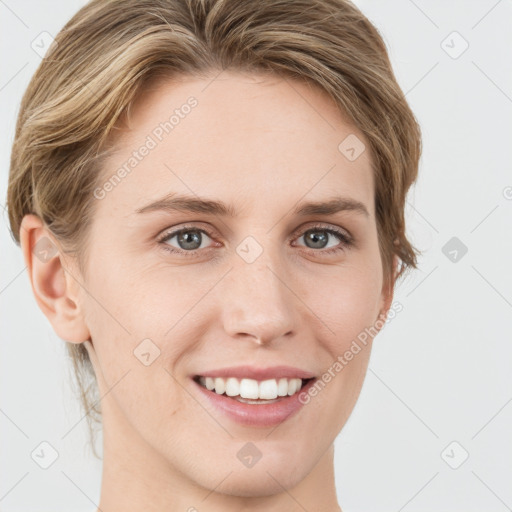 Joyful white young-adult female with medium  brown hair and green eyes