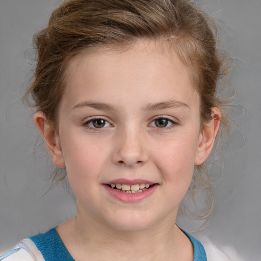 Joyful white child female with medium  brown hair and blue eyes