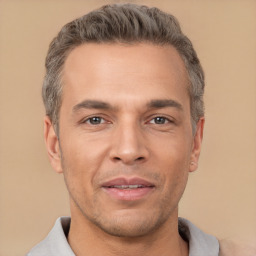 Joyful white adult male with short  brown hair and brown eyes