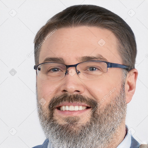 Joyful white adult male with short  brown hair and brown eyes