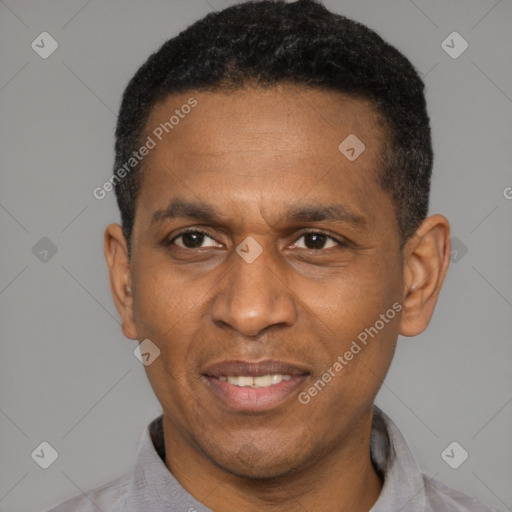 Joyful latino adult male with short  black hair and brown eyes